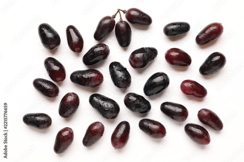 Fototapeta premium Fresh ripe grapes on white background, flat lay