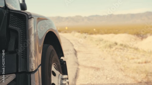 Semi truck driving on a desert highway