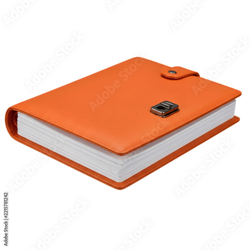 Orange vintage book with black clasp on wooden table