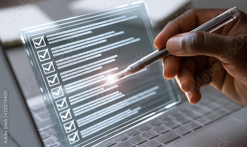Businessman reviewed procedures and processes through a virtual online document with checkboxes, reviewing compliance with company policies, regulations, and terms and conditions.