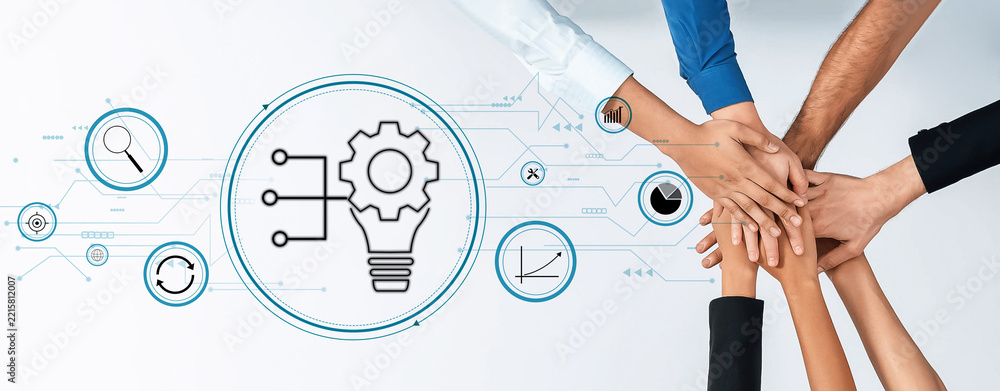 Obraz premium Hands from diverse individuals unite in a collaborative effort, showcasing teamwork and innovation against a digital graphic backdrop representing ideas and technology. Trope