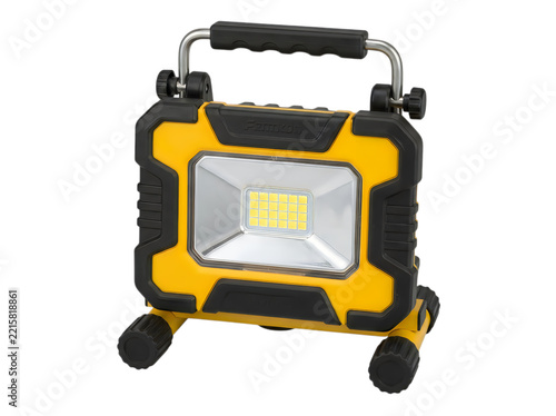 Portable yellow floodlight on wheels outdoors