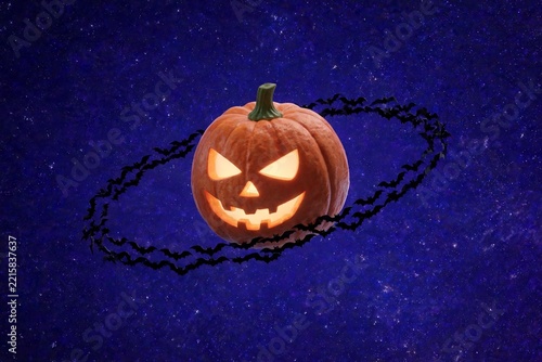 Pumpkin Planet with a Ring of Bats in Purple Space