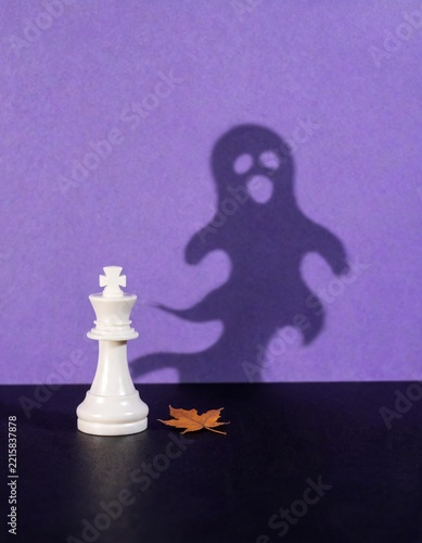 White Chess King Casting a Ghost Shadow on Purple
