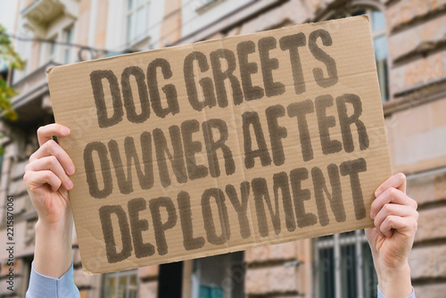 Fotografie "Dog greets owner after deployment" Pet welcomes soldier after months