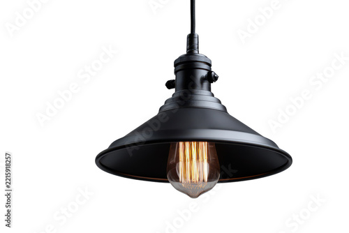 Vintage black metal pendant light fixture with exposed bulb isolated on transparent background. Vintage industrial pendant light with warm glow bulb isolated on white background.