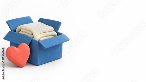 Open Blue Care Box with Cream Blankets and a Coral Clay Heart