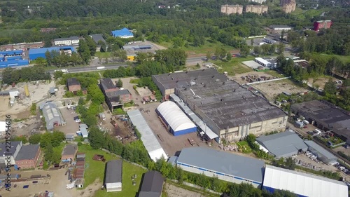 Drone flies forward and down over Klin warehouses