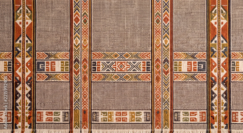 Minimal earthy Inca inspired woven textile background