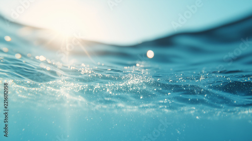 Sparkling blue water surface with bright sunlight