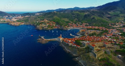 Aerial view of the beautiful, picturesque village of Collioure on the Mediterranean coast, featuring the lovely Fort Saint Elme by the sea, France, near the city of Perpignan.