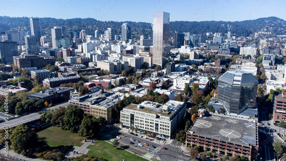 Fototapeta premium aerial shot of downtown Portland, Oregon showing the historic White Stag sign, taken in late 2026.