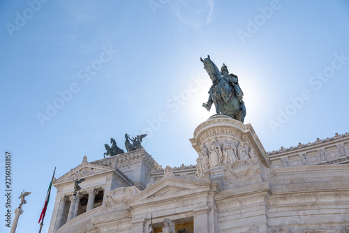 View of the Altare della Patria with the equestrian statue of Victor Emmanuel II against a clear blue sky in Rome, Lazio, Italy.