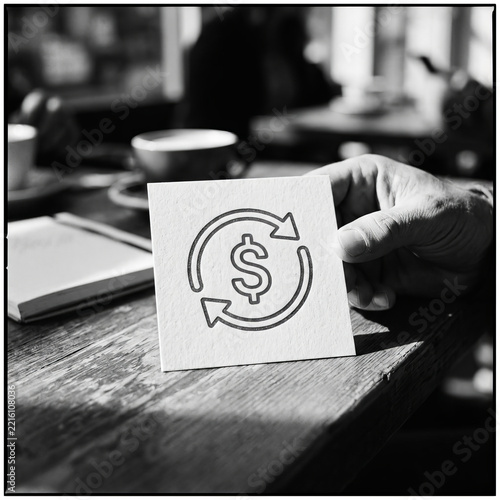 Person holding paper with dollar symbol and rotation arrows, concept of money transfer, investment, and financial cycle.