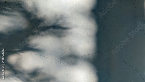 Abstract dark shadow overlay on white wall background with copy space