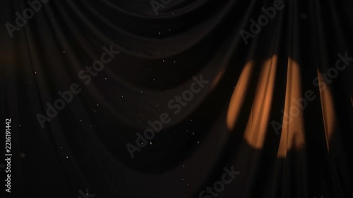 Spotlight Moving Across Draped Black Fabric with Dust Particles