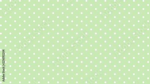 Light green polka dot pattern background wallpaper design with white spots for textile or wrapping paper