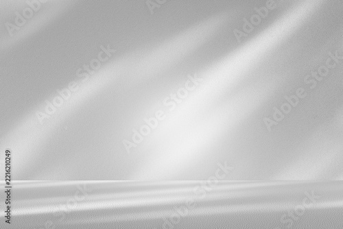 Wall interior background, studio and backdrops show products.with shadow from window color white and grey. background for text insertion and presentation product	
