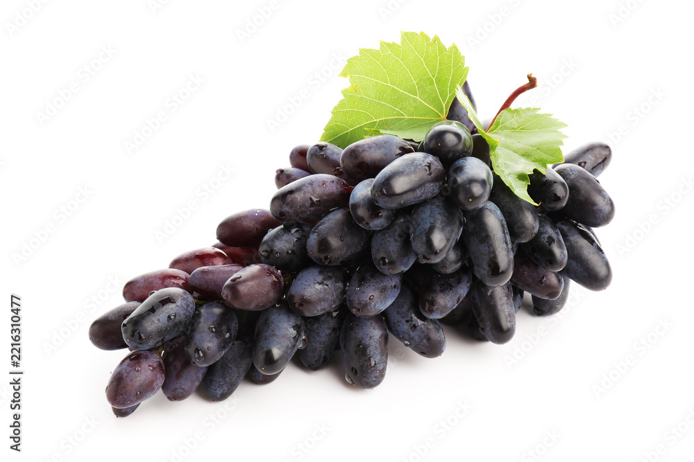 Fototapeta premium Bunch of fresh ripe grapes with green leaves isolated on white