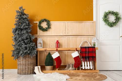 Christmas home interior, holiday season festive decoration with stockings and...