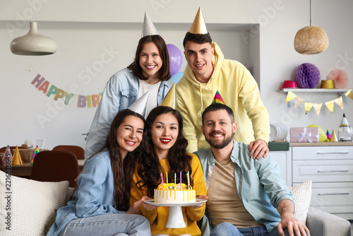 Birthday celebration and friendship, diverse group of friends with cake and p...