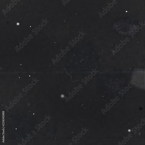 Heavy dust and grime texture with glowing particles on dark film background for retro look.