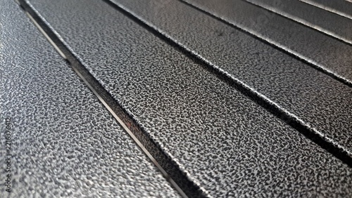 rain drops on a metal surface