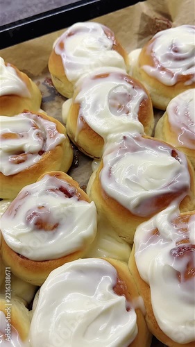 Freshly Baked Cinnamon Rolls with Creamy Icing on Top, Perfectly Fluffy and Golden Brown, Ready to Delight Your Taste Buds and Indulge in Sweetness