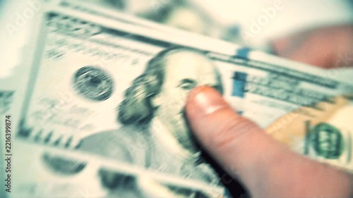 A man considers American money a close-up
