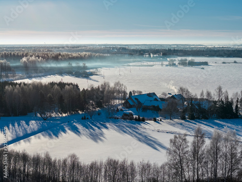 Winter landscape during sunrise in countryside , captured from above