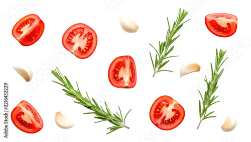 Fresh tomatoes and garlic arranged with rosemary sprigs for culinary inspiration