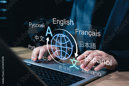 Multilingual language translation technology concept. Businesswoman using laptop with icons various languages, global translation, multilingual communication, international connections, AI translator
