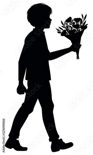 Silhouette of a boy carrying a bouquet