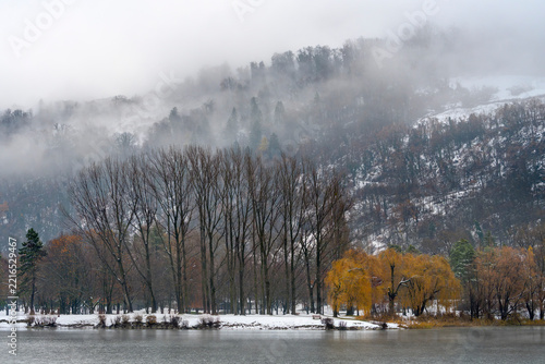 A misty landscape showing the first snows of winter in Switzerland