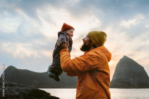 Baby and father enjoying time together family travel dad lifting infant child outdoor, autumn vacations in Norway tour with kid candid emotions happy moment fatherhood childhood Fathers day holiday