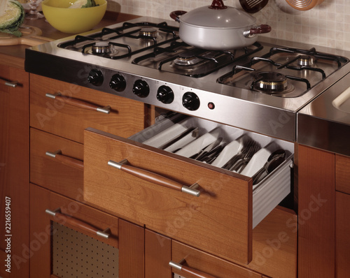 Close up of a kitchen cabinet with drawers and baskets	