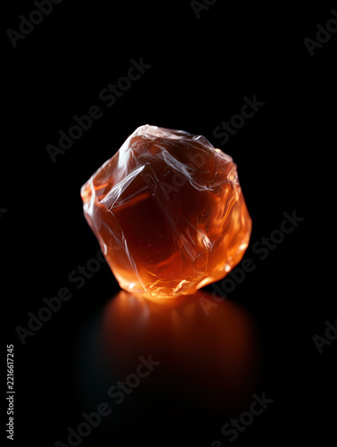 Beautifully Illuminated Orange Abstract Sculpture on Black Background