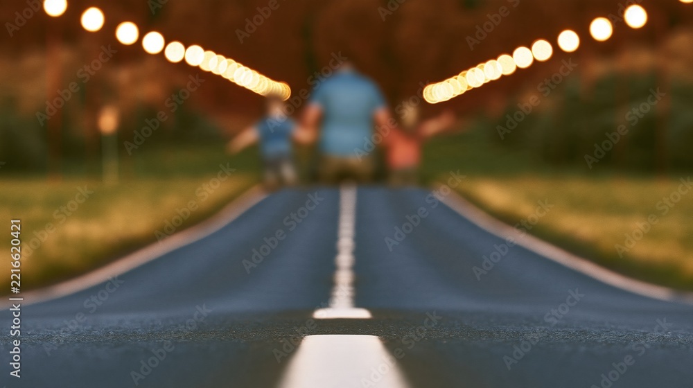 Fototapeta premium Family walking down a lit road at dusk, symbolizing journey and togetherness