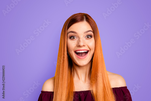 Humans emotions concept! Portrait of excited young woman with big eyes and open mouth isolated on yellow background
