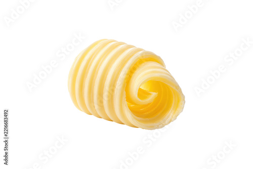 Single spiral curl of fresh yellow butter with smooth creamy layers isolated on a clean white background, ideal for cooking, baking, and food concepts.