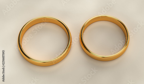 Pair of classic golden wedding rings, two gold bands top view