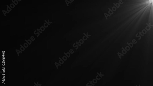Stage spotlight frame animation creating dramatic corner light beams. Soft flare motion forming depth and focus in empty scene layout.