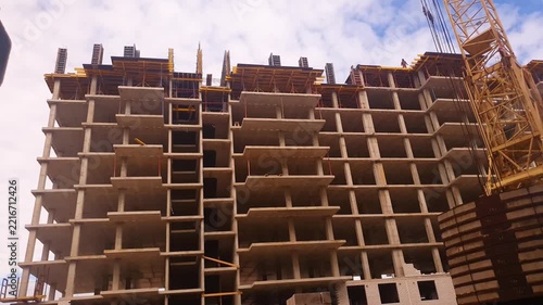 Construction of an apartment building using precast concrete slabs and reinforced concrete structures. Construction site of an apartment building. Housing construction