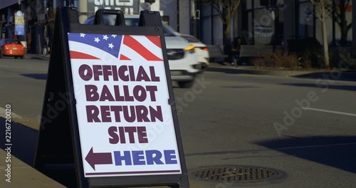 Official ballot return site sign displayed along a busy street, representing voting, elections, democracy and ballot collection in the United States. 15442  