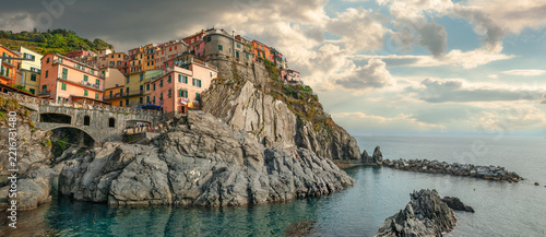 Panorama with colorful houses on rocky cliff in Manarola town. Cinque Terre national park. Liguria, Italy