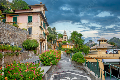 Beautiful landscape with walking path between colorful houses in Portofino. Liguria, Italy