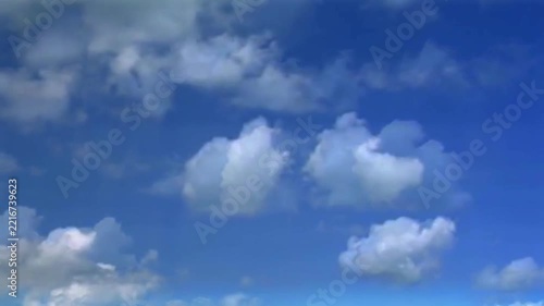Bright Blue Sky with White Fluffy Cumulus Clouds Background