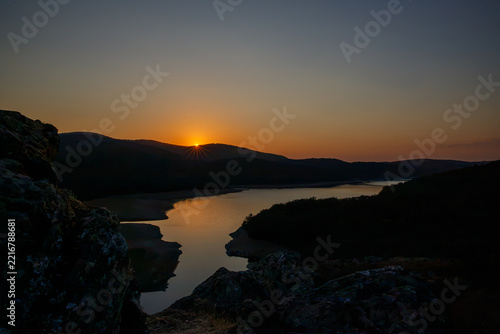 Sunset during the solar eclipse at Embalse del Arl