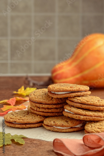oatmeal pumpkin spice whoopie cookies on parchment paper