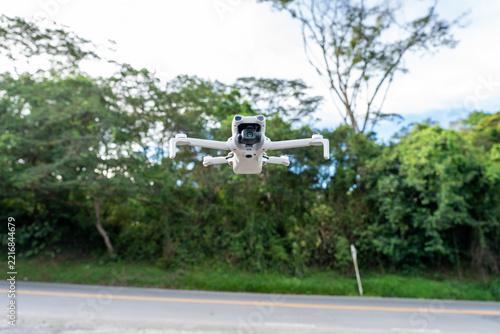 Drone in the air above the ground used for photography and video, close-up